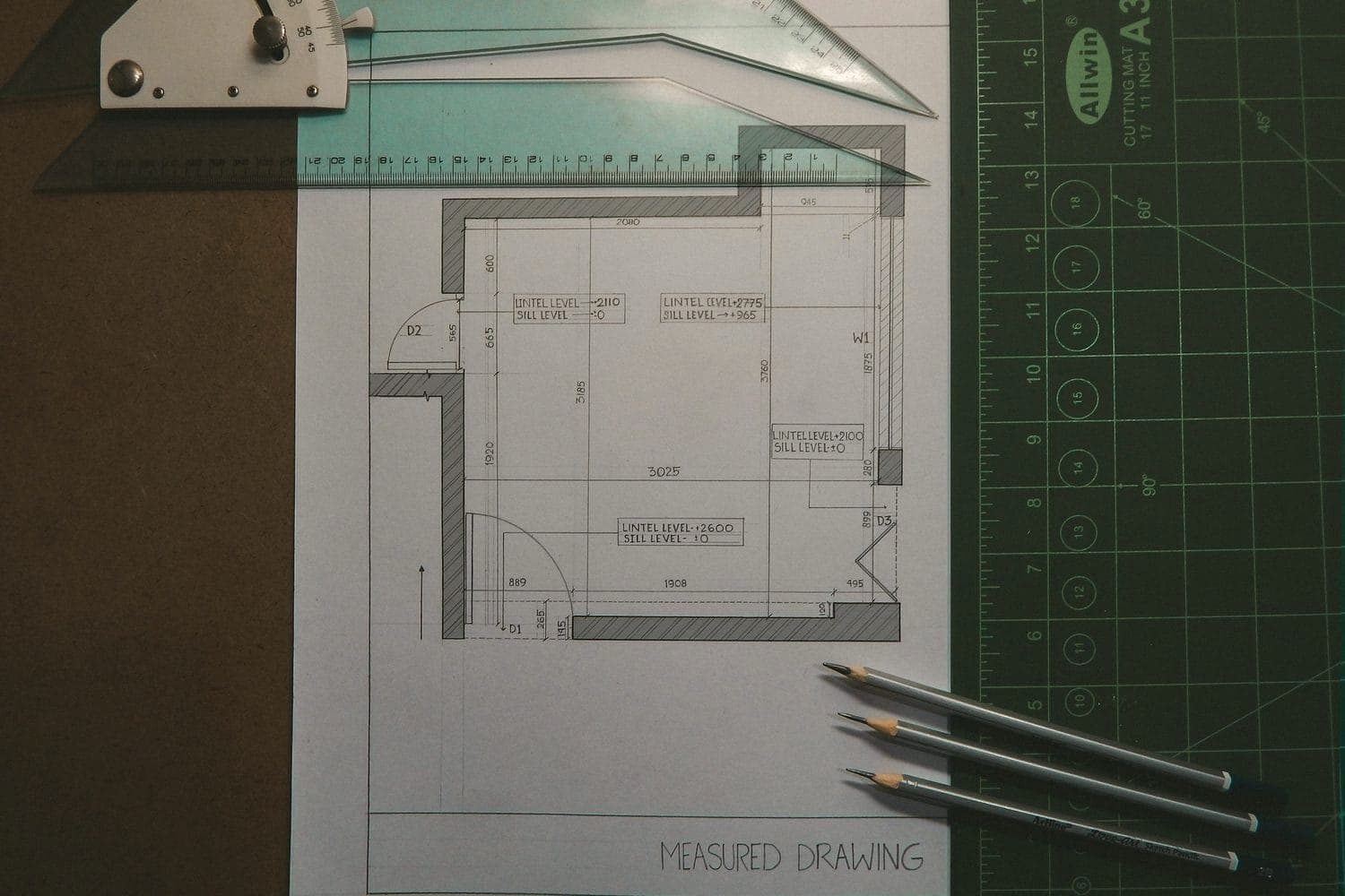 A measured floor-plan drawing with pencils